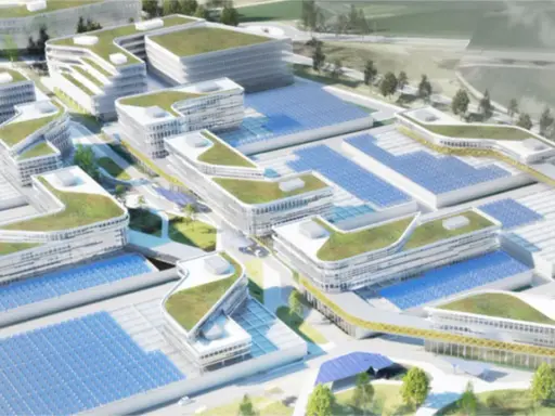 Moderne Gebäude mit begrünten Dächern und Solaranlagen prägen diesen urbanen Lebensraum.